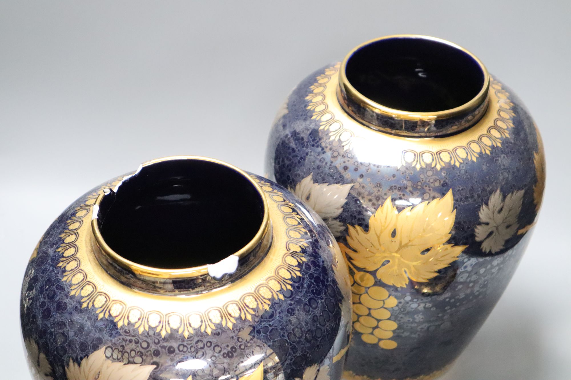 A pair of Artlynsa lustre and gilt decorated vases, height 43cm